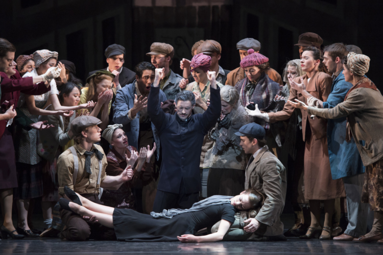 <p><em>Miracle in the Gorbals: </em>Iain Mackay as the Minister and Delia Mathews as the Suicide with Artists of Birmingham Royal Ballet</p>. Credit: Bill Cooper.