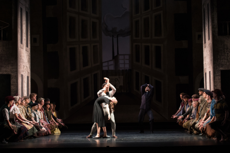 <p><em>Miracle in the Gorbals: </em>Delia Mathews as the Suicide and César Morales as the Stranger with Artists of Birmingham Royal Ballet</p>. Credit: Bill Cooper.