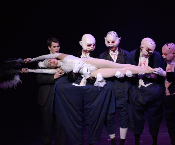 <p><em>Carmina burana: </em>Jenna Roberts as Roast Swan and Mathias Dingman as the Second Seminarian with Artists of Birmingham Royal Ballet as Gluttons</p>. Credit: Bill Cooper.