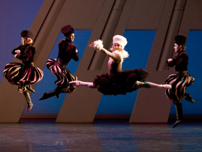 <p><em>The Nutcracker Sweeties: </em>Lei Zhao as Volga Vouty with Artists of Birmingham Royal Ballet</p>. Credit: Bill Cooper.