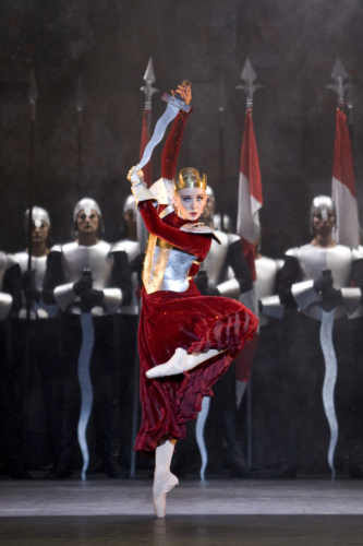 <p><em>Edward II: </em>Elisha Willis as Queen Isabella with Artists of Birmingham Royal Ballet</p>. Credit: Bill Cooper.
